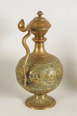 Lot 230 - A VERY LARGE BRASS EWER