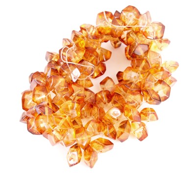 Lot 358 - AN AMBER BEAD BRACELET of faceted designs -...
