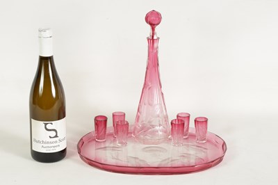 Lot 11 - AN ART NOUVEAU RUBY AND CLEAR GLASS MOSER DECANTER, TRAY AND SIX GLASSES
