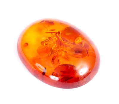 Lot 360 - A PIECE OF OVAL AMBER FROM A BROOCH with...