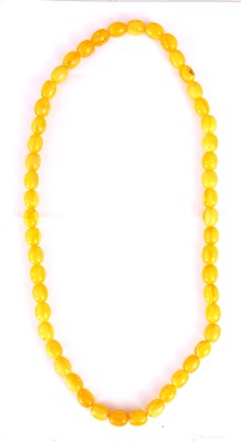 Lot 362 - A YELLOW AMBER BEAD NECKLACE on string, of...