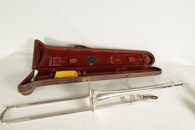 Lot 109 - A MID 20TH CENTURY SILVERED BRASS AND BRIGHT CUT MOUNTED CASED TROMBONE