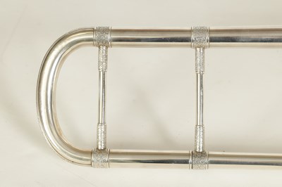 Lot 109 - A MID 20TH CENTURY SILVERED BRASS AND BRIGHT CUT MOUNTED CASED TROMBONE