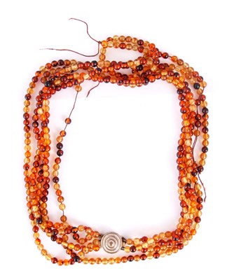 Lot 376 - A MULTI-STRAND AMBER BEAD NECKLACE on string...