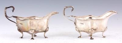 Lot 3 - A PAIR OF EARLY 20TH CENTURY SILVER SAUCE...