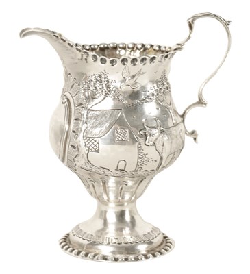 Lot 554 - AN UNUSUAL GEORGE II SILVER AND GILT CREAM JUG