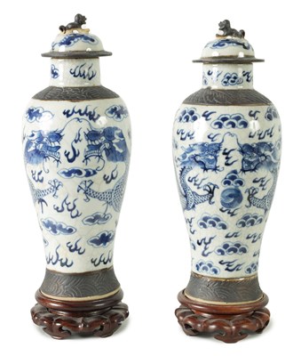 Lot 350 - A PAIR OF 19TH CENTURY CHINESE CRACKLE GLAZE LIDDED VASES