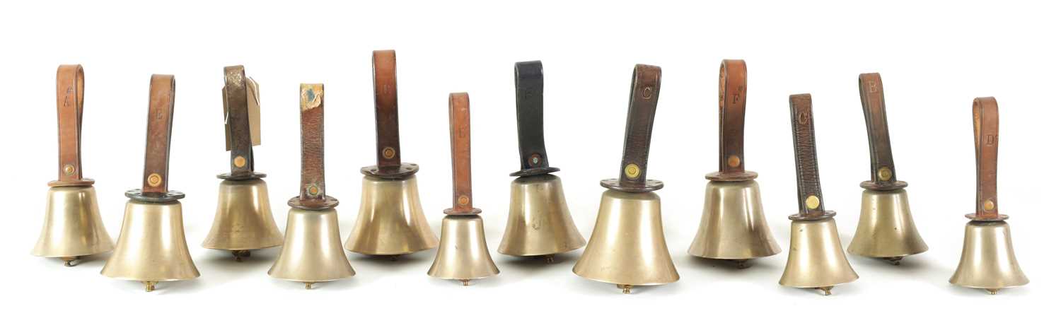 Many Hand Bells Lot 147 - A SET OF 12 HAND BELLS SIGNED WARNER, LONDON