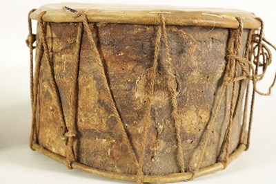 Lot 148 - A VINTAGE SNAKE SKIN TAMBOURINE TOGETHER WITH A BARK DRUM