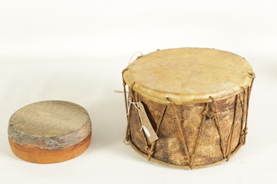 Lot 148 - A VINTAGE SNAKE SKIN TAMBOURINE TOGETHER WITH A BARK DRUM