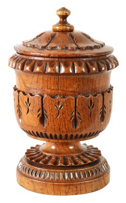 Lot 784 - AN UNUSUAL LATE REGENCY OAK URN SHAPED TEA CADDY