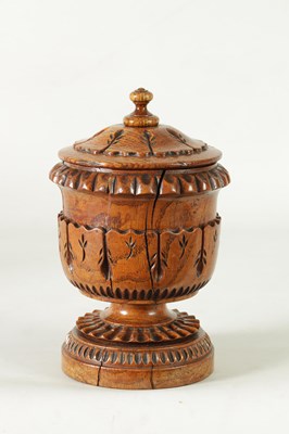Lot 784 - AN UNUSUAL LATE REGENCY OAK URN SHAPED TEA CADDY