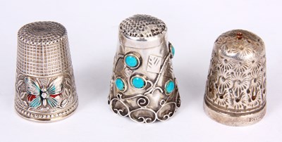 Lot 57 - A SILVER AND TURQUOISE MOUNTED THIMBLE and two...