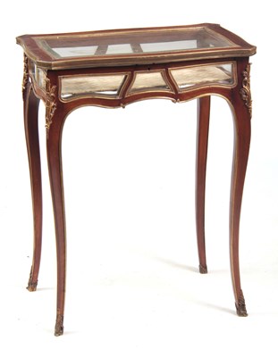 Lot 1435 - A 19TH CENTURY ORMOLU MOUNTED SERPENTINE SHAPED MAHOGANY BIJOUTERIE TABLE