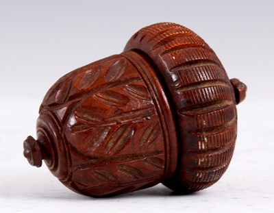 Lot 78 - A 19TH CENTURY CARVED TREEN WARE NUTMEG...