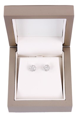 Lot 50 - A PAIR OF 18ct WHITE GOLD AND DIAMOND CLUSTER...