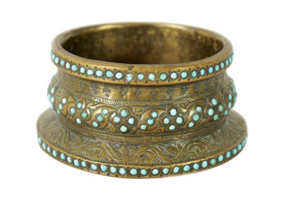 Lot 449 - A 19TH CENTURY PERSIAN JEWELLED TURQUOISE GILT METAL BANGLE