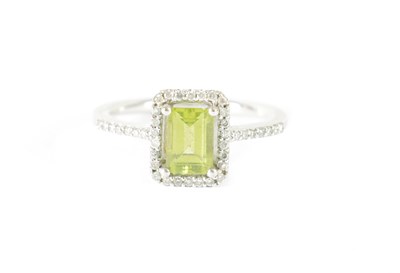 Lot 395 - A 9CT WHITE GOLD PERIDOT AND DIAMOND RING