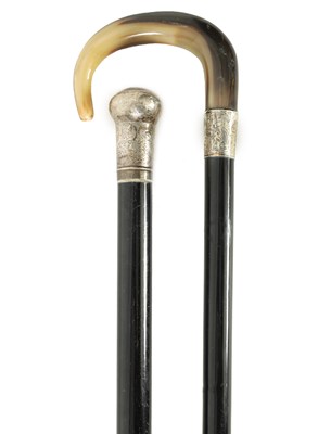 Lot 685 - TWO EARLY 20TH CENTURY SILVER MOUNTED EBONISED WALKING STICKS