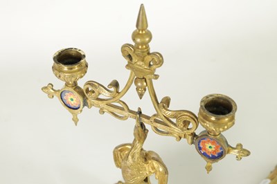 Lot 857 - A PAIR OF LATE 19TH CENTURY BRASS AESTHETIC PERIOD DOUBLE BRANCH CANDELABRA