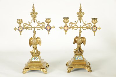 Lot 857 - A PAIR OF LATE 19TH CENTURY BRASS AESTHETIC PERIOD DOUBLE BRANCH CANDELABRA