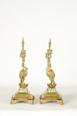 Lot 857 - A PAIR OF LATE 19TH CENTURY BRASS AESTHETIC PERIOD DOUBLE BRANCH CANDELABRA