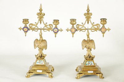 Lot 857 - A PAIR OF LATE 19TH CENTURY BRASS AESTHETIC PERIOD DOUBLE BRANCH CANDELABRA