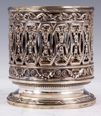 Lot 90 - AN ORNATE SILVER BOTTLE COASTER POSSIBLY...