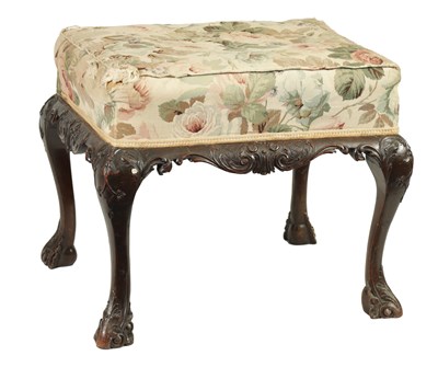 Lot 1473 - AN EARLY GEORGE III CHIPPENDALE CARVED MAHOGANY UPHOLSTERED STOOL