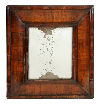 Lot 1441 - A WILLIAM AND MARY CUSHION FRAMED WALNUT HANGING MIRROR