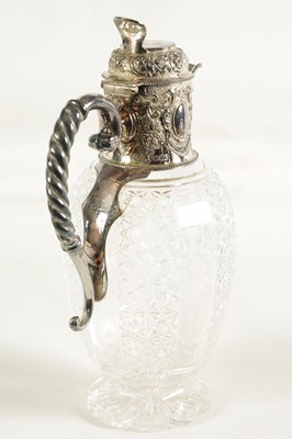 Lot 308 - A VICTORIAN SILVER AND CUT GLASS CLARET JUG