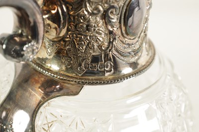 Lot 308 - A VICTORIAN SILVER AND CUT GLASS CLARET JUG