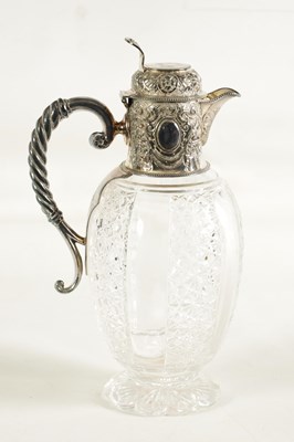 Lot 308 - A VICTORIAN SILVER AND CUT GLASS CLARET JUG