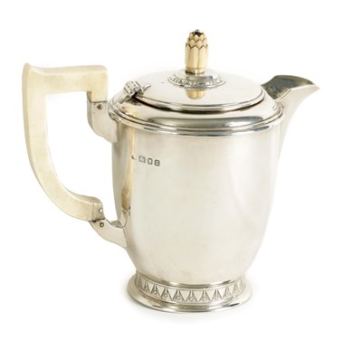 Lot 280 - AN ART DECO IVORY HANDLED SILVER HOT WATER JUG