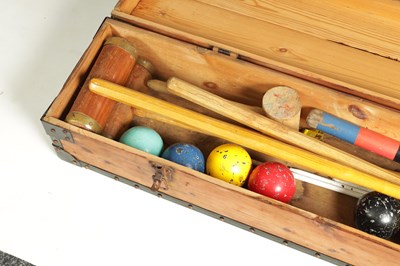 Lot 587 - A CASED CROQUET SET