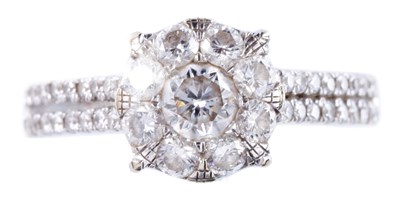 Lot 6 - AN 18ct WHITE GOLD SEVEN STONE CLUSTER DIAMOND...