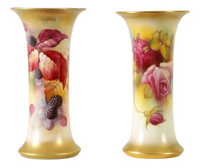 Lot 129 - TWO EARLY 20TH CENTURY ROYAL WORCESTER SPILL VASES DECORATED IN AUTUMN BERRIES SIGNED KITTY BLAKE AND ROSES SIGNED BY M. HUNT