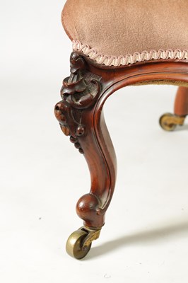 Lot 1329 - A PAIR OF VICTORIAN CARVED WALNUT DRAWING ROOM BUTTON-UPHOLSTERED CHAIRS