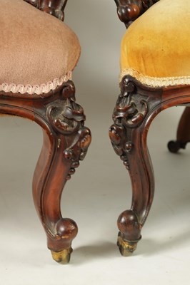 Lot 1329 - A PAIR OF VICTORIAN CARVED WALNUT DRAWING ROOM BUTTON-UPHOLSTERED CHAIRS