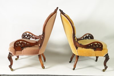 Lot 1329 - A PAIR OF VICTORIAN CARVED WALNUT DRAWING ROOM BUTTON-UPHOLSTERED CHAIRS