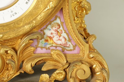 Lot 1238 - A LATE 19TH CENTURY FRENCH ORMOLU AND PORCELAIN PANELLED CALENDAR CLOCK