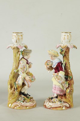 Lot 55 - A PAIR OF 19TH CENTURY JOHN BEVINGTON FLORALLY ENCRUSTED FIGURAL CANDLESTICKS