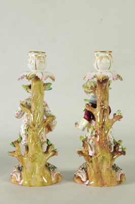 Lot 55 - A PAIR OF 19TH CENTURY JOHN BEVINGTON FLORALLY ENCRUSTED FIGURAL CANDLESTICKS
