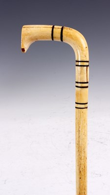 Lot 129 - A GEORGE III WHALE BONE AND EBONY BANDED...