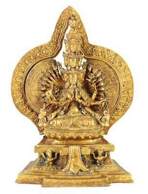 Lot 196 - AN EARLY GILT BRONZE TIBETAN BUDDHA DEITY