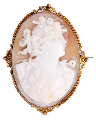 Lot 138 - A GOLD METAL MOUNTED CAMEO portrait of a woman...