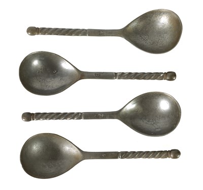 Lot 729 - A RARE SET OF FOUR EARLY 18TH CENTURY PEWTER SPOONS