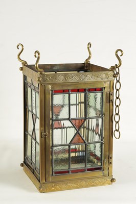 Lot 611 - A LATE 19TH CENTURY BRASS AND STAINED GLASS HALL LANTERN