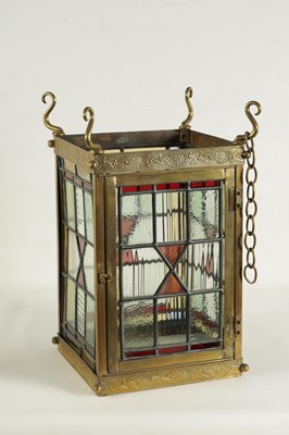 Lot 611 - A LATE 19TH CENTURY BRASS AND STAINED GLASS HALL LANTERN