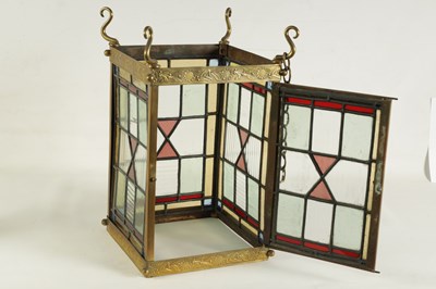 Lot 611 - A LATE 19TH CENTURY BRASS AND STAINED GLASS HALL LANTERN